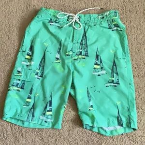 NEVER WORN size small swim trunks. Light green with sailboat/yacht pattern.